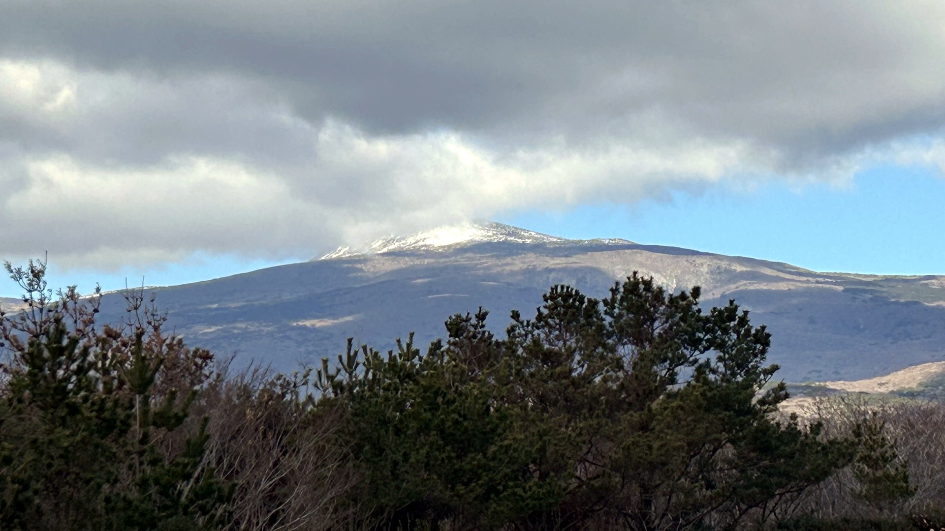 Snow on Hallasan Mountain viewed from a Jeju golf course